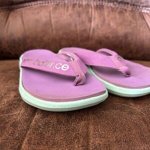 New Balance flip flops.